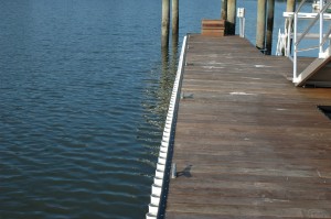 ipe floating dock with black rub rail and white wave guard